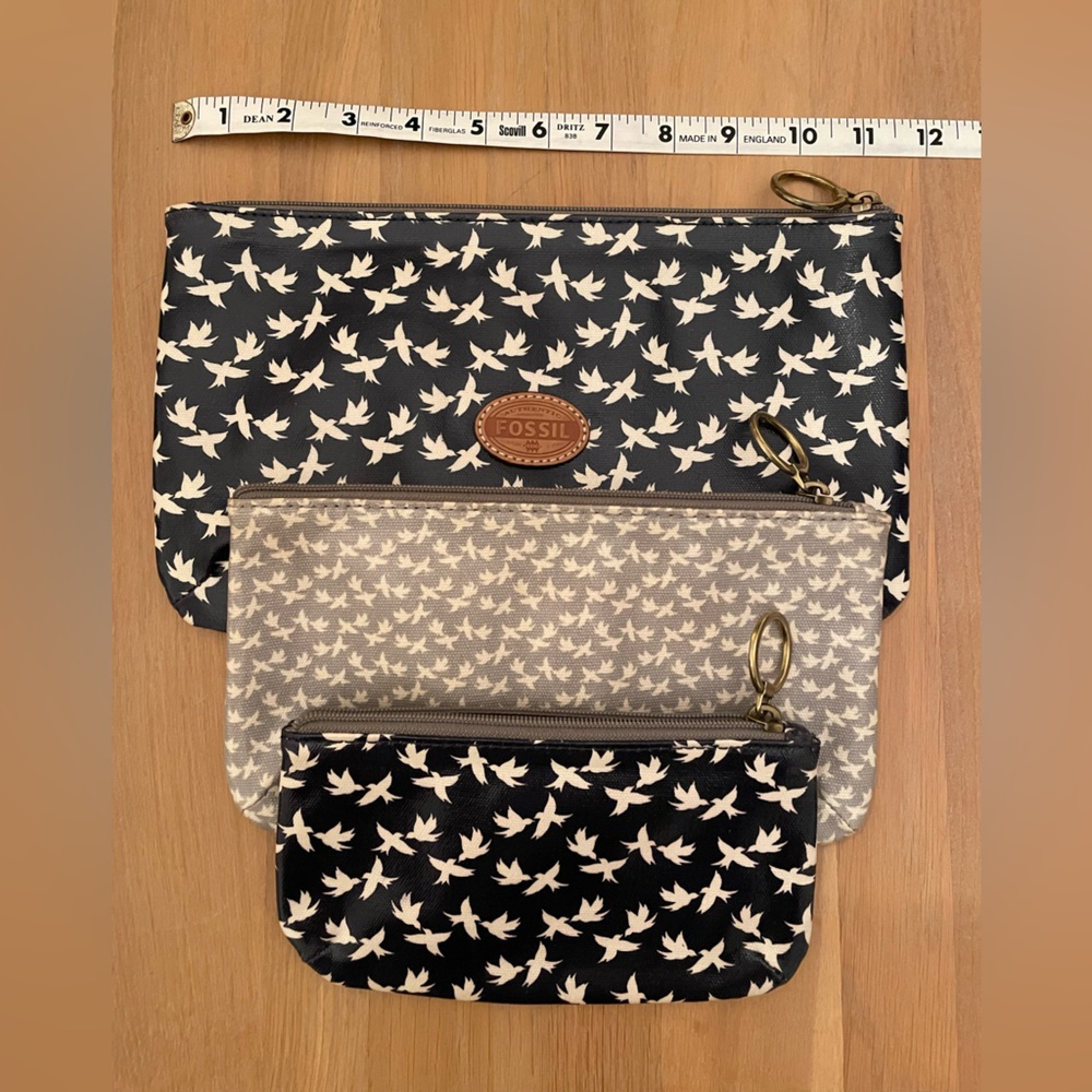 Fossil 3 pack of zip pouches. 2 navy blue with birds, 1 grey with birds